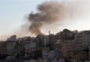 Smoke rises during sectarian clashes between Sunni Muslims and Alawites in Tripoli, northern Lebanon